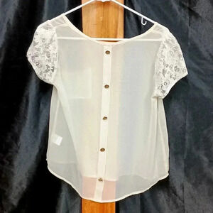 Cream colored lush cardigan with lacework sleeves and button up back like new
